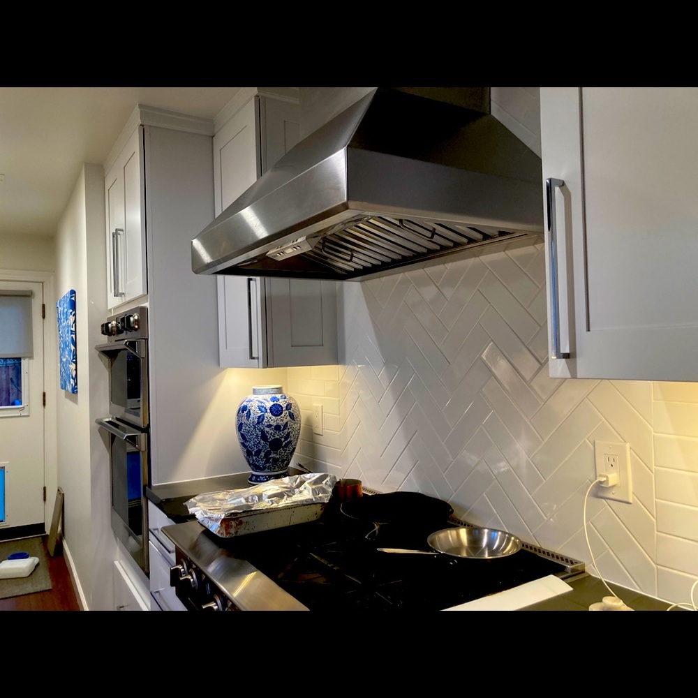 Polished chrome kitchen cabinet and drawer pulls.